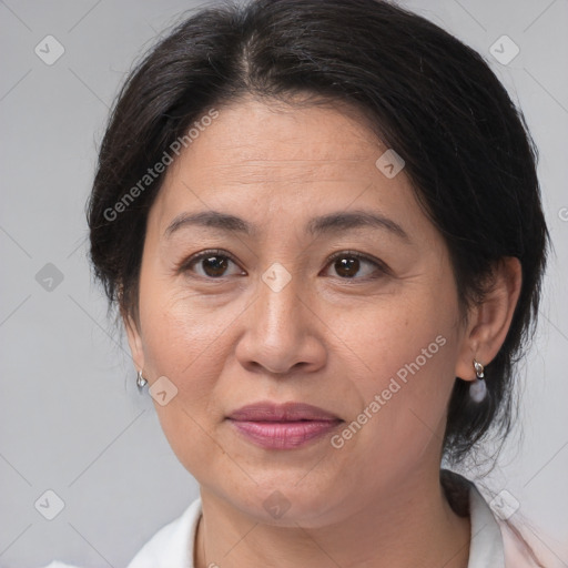 Joyful white adult female with medium  brown hair and brown eyes