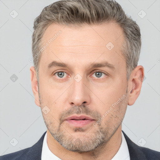 Neutral white adult male with short  brown hair and brown eyes