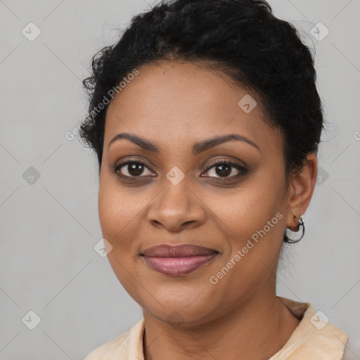 Joyful black young-adult female with short  brown hair and brown eyes