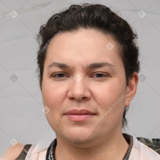 Joyful white adult female with short  brown hair and brown eyes