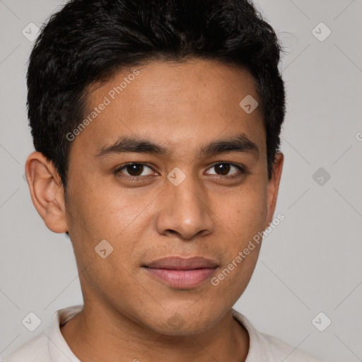 Joyful latino young-adult male with short  brown hair and brown eyes