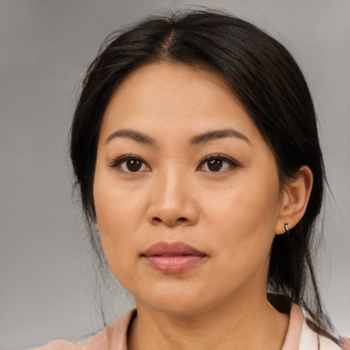 Neutral asian young-adult female with medium  brown hair and brown eyes