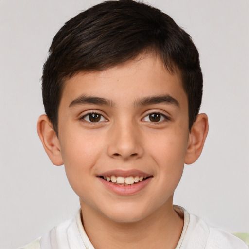 Joyful white child male with short  brown hair and brown eyes