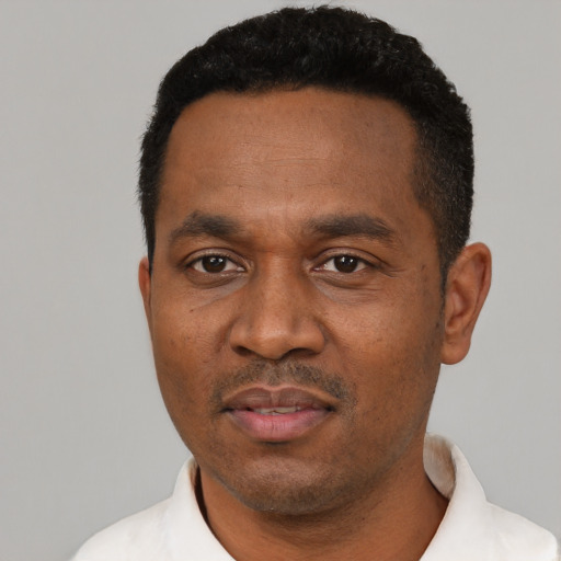 Neutral black adult male with short  black hair and brown eyes