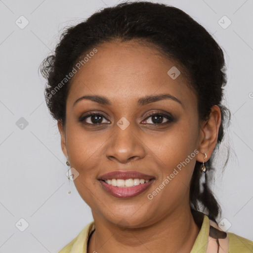 Joyful black young-adult female with medium  brown hair and brown eyes