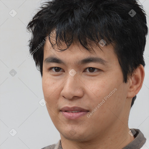 Joyful asian young-adult male with short  brown hair and brown eyes