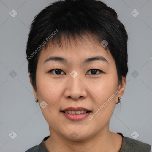 Joyful asian young-adult female with short  brown hair and brown eyes