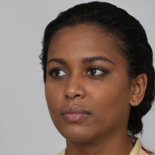 Neutral black young-adult female with short  black hair and brown eyes