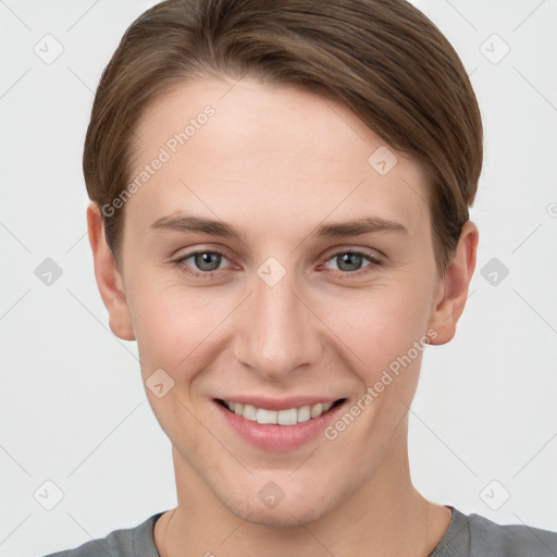 Joyful white young-adult female with short  brown hair and grey eyes