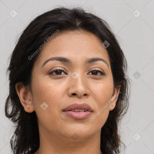 Joyful latino young-adult female with medium  brown hair and brown eyes