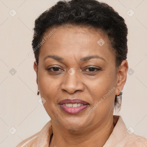 Joyful latino adult female with short  brown hair and brown eyes