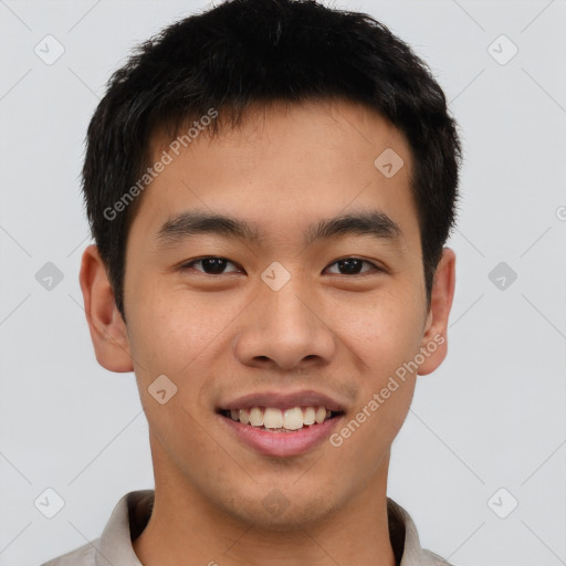 Joyful asian young-adult male with short  brown hair and brown eyes