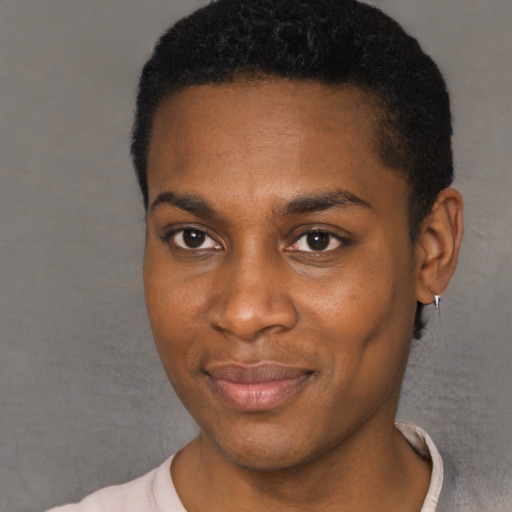 Joyful black young-adult male with short  black hair and brown eyes
