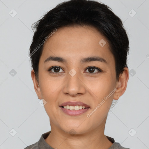 Joyful asian young-adult female with short  black hair and brown eyes