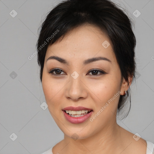 Joyful asian young-adult female with medium  black hair and brown eyes