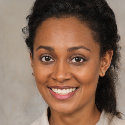 Joyful black young-adult female with medium  brown hair and brown eyes