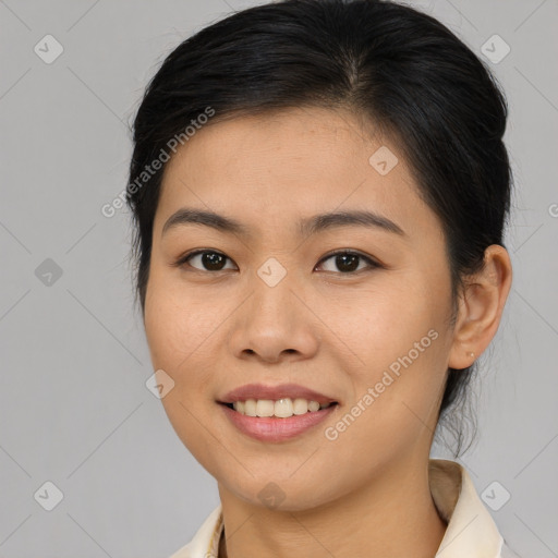 Joyful asian young-adult female with medium  brown hair and brown eyes