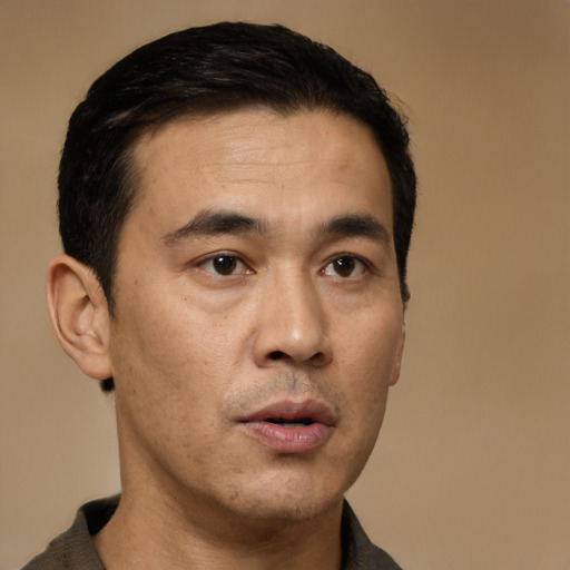 Neutral asian adult male with short  black hair and brown eyes