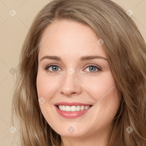 Joyful white young-adult female with long  brown hair and green eyes