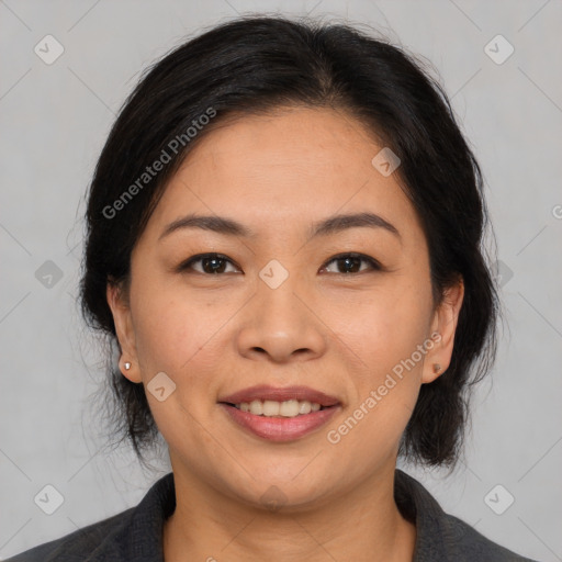 Joyful latino young-adult female with medium  brown hair and brown eyes