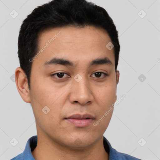 Joyful white young-adult male with short  black hair and brown eyes