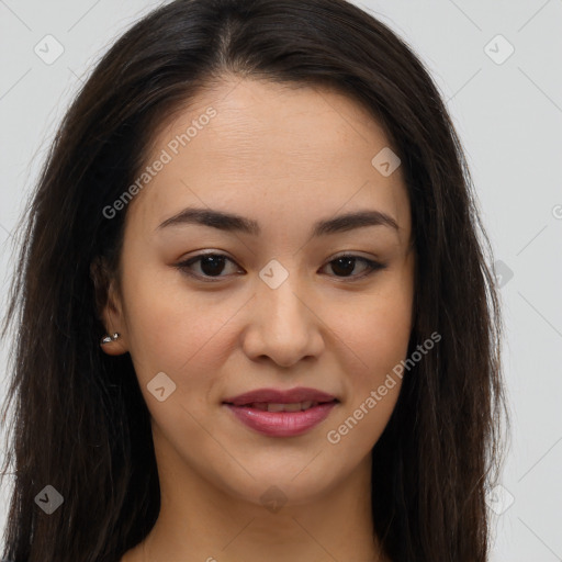 Joyful asian young-adult female with long  brown hair and brown eyes