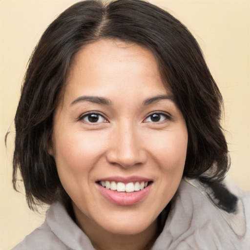 Joyful white young-adult female with medium  brown hair and brown eyes