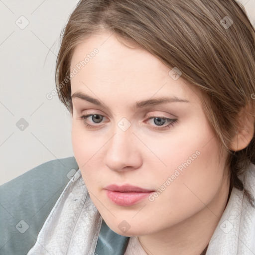 Neutral white young-adult female with medium  brown hair and grey eyes