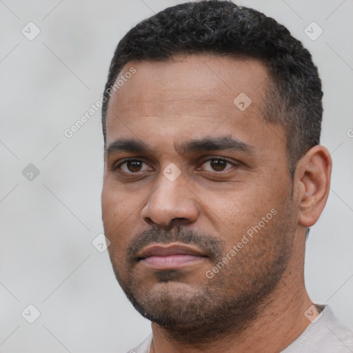 Neutral black young-adult male with short  black hair and brown eyes