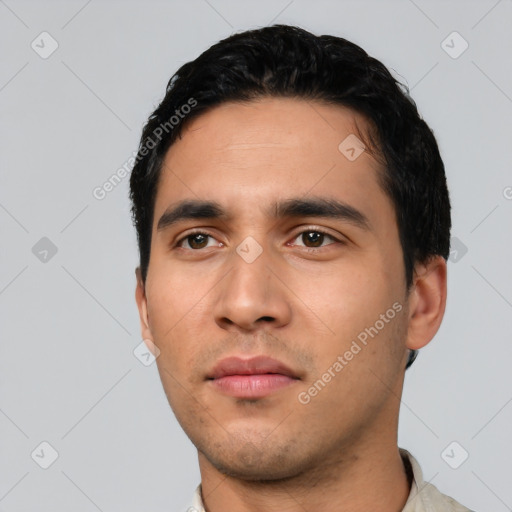 Neutral latino young-adult male with short  black hair and brown eyes