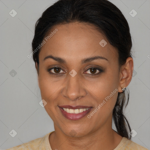 Joyful latino young-adult female with medium  brown hair and brown eyes