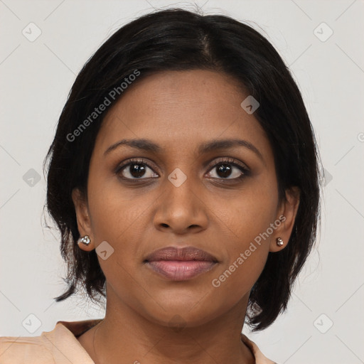 Joyful black young-adult female with medium  brown hair and brown eyes