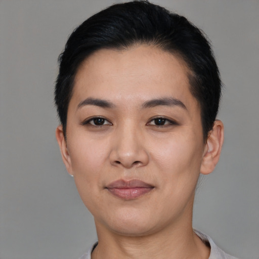 Joyful asian young-adult female with short  black hair and brown eyes