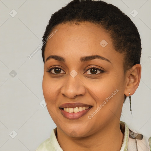 Joyful latino young-adult female with short  black hair and brown eyes