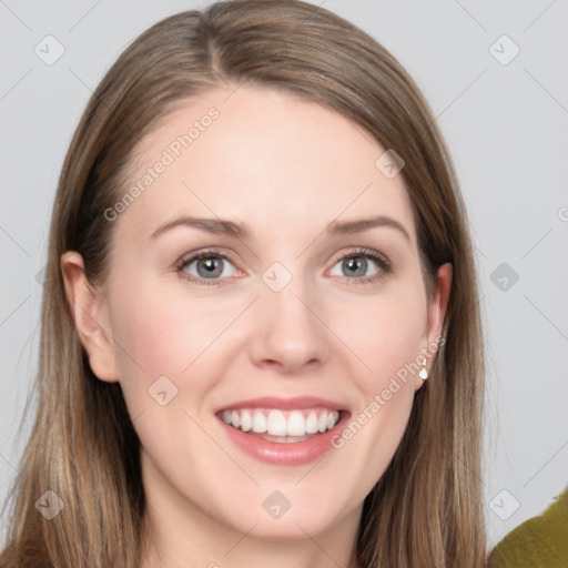 Joyful white young-adult female with long  brown hair and grey eyes