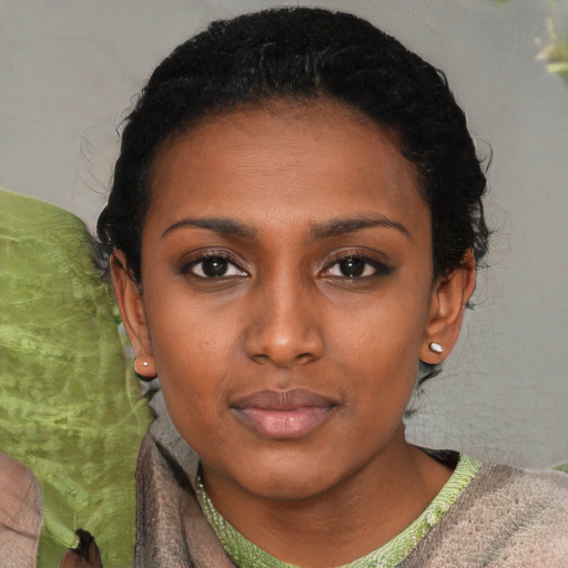 Neutral black young-adult female with short  black hair and brown eyes
