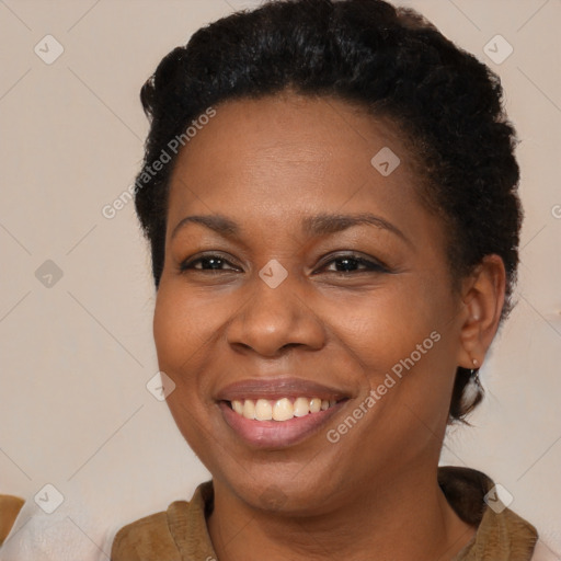 Joyful black adult female with short  brown hair and brown eyes