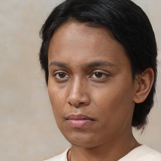 Neutral latino young-adult female with medium  black hair and brown eyes