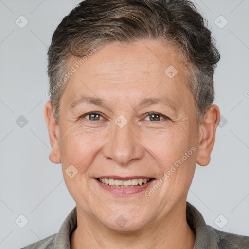 Joyful white middle-aged female with short  brown hair and brown eyes