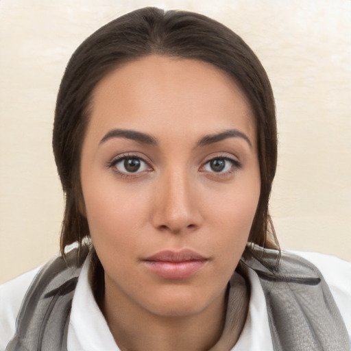 Neutral white young-adult female with long  brown hair and brown eyes