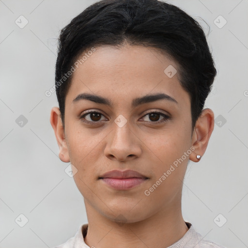 Joyful latino young-adult female with short  black hair and brown eyes