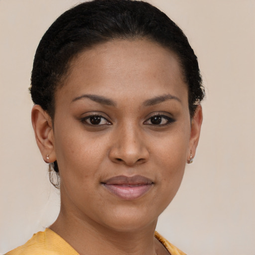 Joyful black young-adult female with short  brown hair and brown eyes