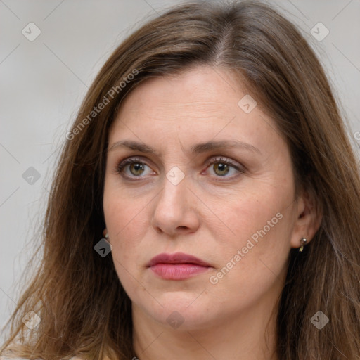 Joyful white adult female with long  brown hair and grey eyes