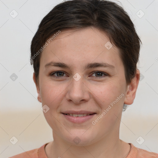 Joyful white young-adult female with short  brown hair and brown eyes