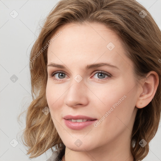 Joyful white young-adult female with long  brown hair and blue eyes