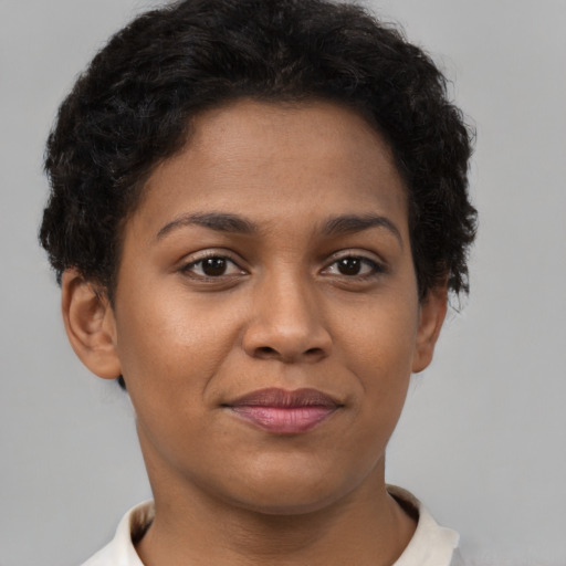 Joyful latino young-adult female with short  brown hair and brown eyes