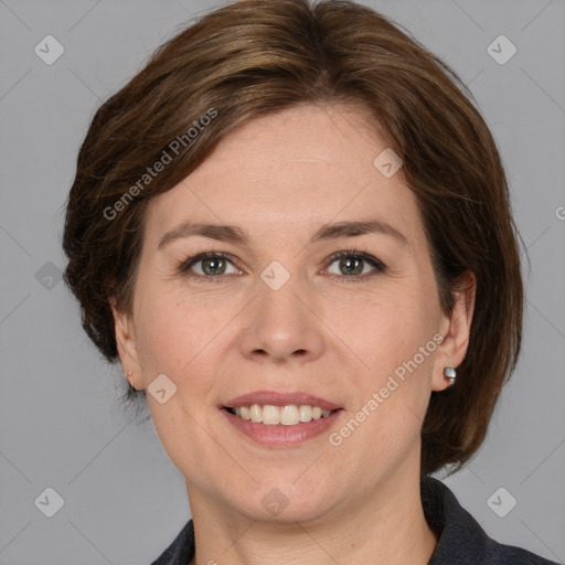 Joyful white adult female with medium  brown hair and grey eyes