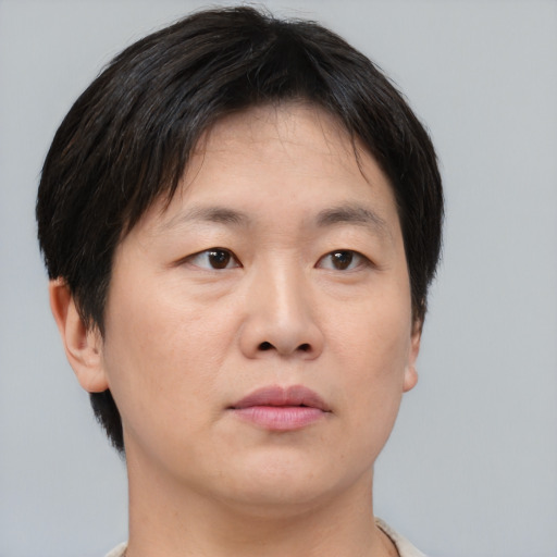 Neutral asian young-adult female with short  brown hair and brown eyes