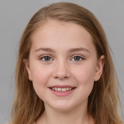 Joyful white child female with long  brown hair and blue eyes