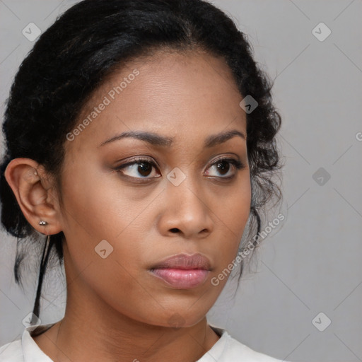 Neutral black young-adult female with medium  brown hair and brown eyes